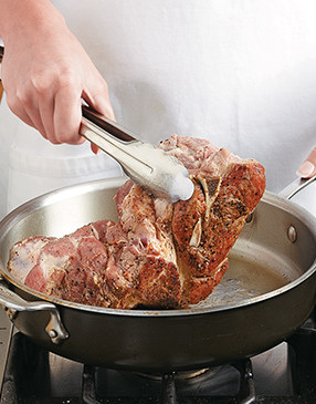 Browning the pork before adding to the slow cooker not only enhances its flavor but its texture, too.