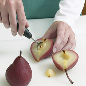 To halve the pears after poaching, cut them through the middle and use a melon baller to scoop out the seeds.