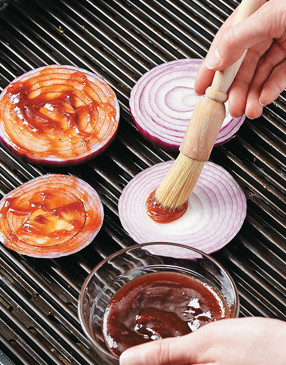 Frequently flip the onion slices while grilling, brushing both sides with additional sauce.