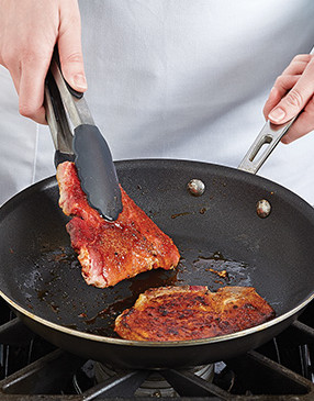 Keep an eye on the chops — they are thin, will cook quickly, and the sugar in the rub will burn.