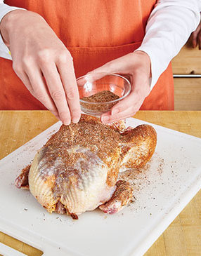 Since the chicken skin doesn’t brown under pressure, sprinkle it with spices for visual appeal.