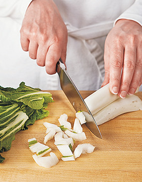 Separate the bok choy ribs from the leaves &mdash; they'll be added to the stir-fry at different times.