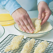 Dredge fish in flour, dip in the egg mixture, then coat with panko. Briefly air dry fish on a rack. 