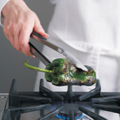Roast poblanos over a gas flame until peppers are blackened, or you can roast them in a hot oven.