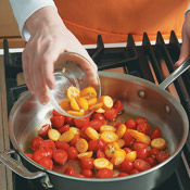 Saut&eacute; tomatoes and kumquats before adding vinegar and seasonings. Stir in scallions before serving. 