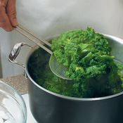 After boiling greens, use a slotted spoon to transfer them quickly to a bowl of ice water. Plunge greens in cold water for 1 minute to stop the cooking. 