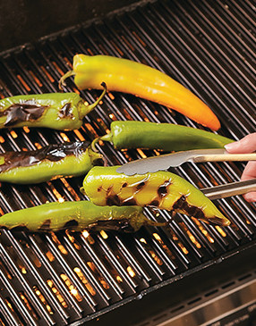 Grill chiles until lightly charred all over. After steaming, the black skin will flake right off.