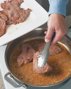 After making the sauce, return the steaks to the pan just to coat with sauce &mdash; don't leave them in too long or they'll overcook.