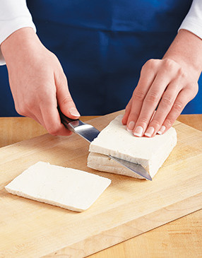 Cutting the tofu "steaks" thin allows them to be submerged in the marinade for better flavor.