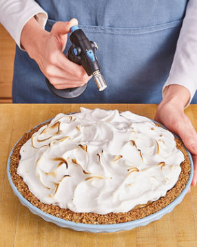Torch the meringue, rather than broil it, for the most control on where and how dark the meringue gets.