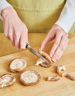 Because the shiitake stems are tough and woody, cut them off and discard, or save them for stock.