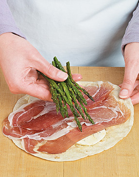 It's easiest to tightly roll the wraps if you place the asparagus slightly off center before rolling.