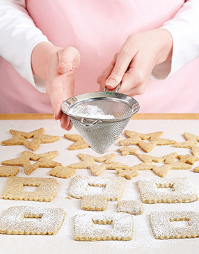 Wait until cookies cool completely before sprinkling with powdered sugar so it doesn’t melt.