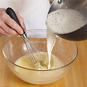 To prevent curdling, temper egg mixture by whisking in warm milk, then return to heat to thicken.