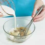 Whisk buttermilk into the ingredients for the dressing. It provides a thick consistency and tangy flavor. 