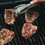 Coat chops with rosemary rub. Grill chops for 5&ndash;6 minutes, flip, and grill for 5&ndash;6 minutes more.