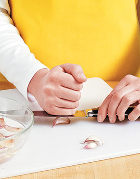 To make easy work of peeling garlic cloves, smash them with the flat side of a knife, then soak in water.