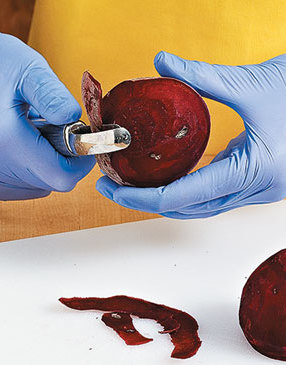 Avoid getting purple stains on your hands by wearing gloves while peeling and dicing the beets.