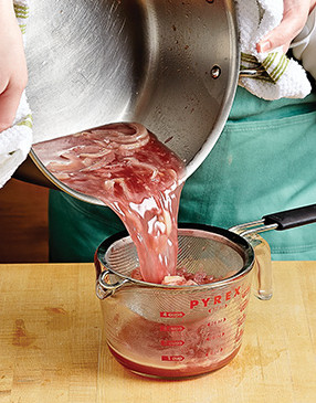 To determine if wine is reduced enough, strain it and solids through a sieve set over a measuring cup.