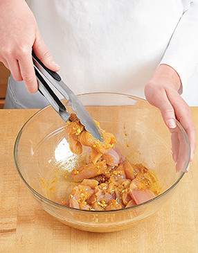 Toss chicken with the curry mixture so it's thoroughly coated, then let it marinate to pick up the flavor.