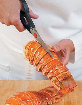 Using kitchen shears is a safe and effective way to easily cut through tough lobster shells.