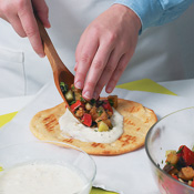 Assemble gyros on foil or parchment, then wrap. This wrapping makes the gyros easier to eat. 