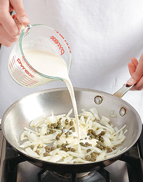 Add capers and heavy cream to the sauté pan to form the sauce. It starts thin, but thickens as it cooks.