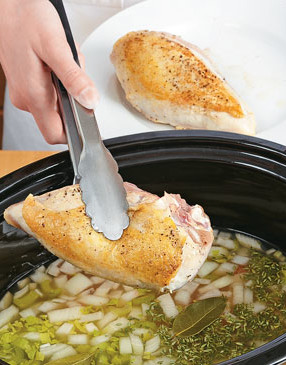 Set the browned chicken breasts on top of the broth mixture. The bones will enhance the taste of the broth.