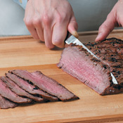 Slice the steak against the grain into tender, thin pieces. Divide steak slices evenly between tortillas. 