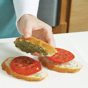 Top the tomato with a pesto-covered slice of bread, then grill sandwiches until toasted.