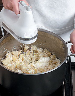 Beat potato mixture using a hand mixer. Be careful not to overmix them or the potatoes will turn gluey.