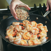 Combine the garlic and seasonings, then add them to the shrimp in the skillet; cook 1 minute to mellow the flavor of the garlic. 