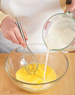 To prevent curdling the egg yolks, whisk in a portion of the hot liquid before returning to the heat.