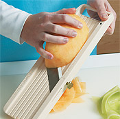 A mandoline is ideal for slicing thin ribbons of melon. If using a knife, try to shave the melon as thin as possible.