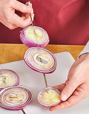For ease of grilling and flipping, cut the onion thick enough so you can skewer the slices.