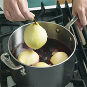 To ensure that the sugar dissolves thoroughly, heat the wine mixture before adding the pears.