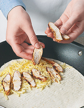 Cook two quesadillas at a time until golden brown on both sides, flipping carefully with a spatula.