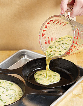 Pouring the egg mixture into the preheated skillets helps the eggs cook faster and frittatas set up.