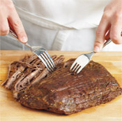 When the steak is fully cooked and slightly cooled, it easily can be shredded using two forks. 