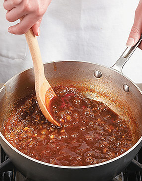 To create a powerful Whiskey Cola BBQ Sauce, reduce the leftover marinade to concentrate its flavors.