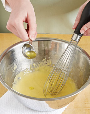 To emulsify the butter with the vinegar without it separating, whisk it in a drop at a time to equalize the temperature between them.