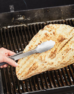 You’ll know it’s time to pull the crust from the grill once the first side has grill marks and the dough puffs up.