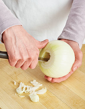 Going through the blossom end, cut a 1-inch-diameter hole from the center of the onion, cutting up to, but not going through the root end.