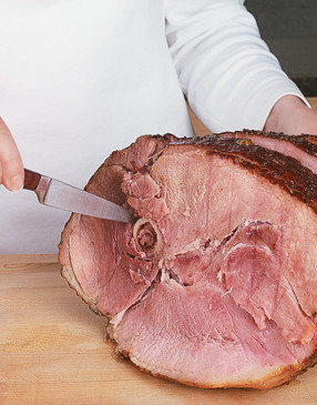 For easier serving, cut around the ham bone to help loosen the attached slices of ham.