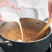Stir in the cream and vanilla. The caramel will bubble furiously. Keep stirring to combine ingredients.