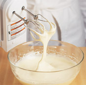Beating the eggs with sugar to the ribbon stage incorporates air and creates a pale-colored mixture.