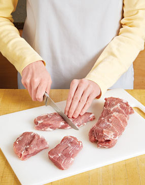 After trimming the pork, cut it into large uniform-sized chunks so it cooks evenly and more quickly.