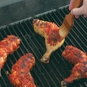 Baste the chicken only after it has have been well-grilled on each side. Otherwise the sauce will burn before the chicken is thoroughly cooked.