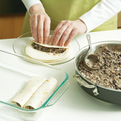 Roll 1/3 cup bean mixture into each torilla; lightly press the filling as you roll to the end. 