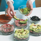 Layer the individual salads into bowls. Don&rsquo;t be too fussy; eyeballing the amounts for each layer is fine.